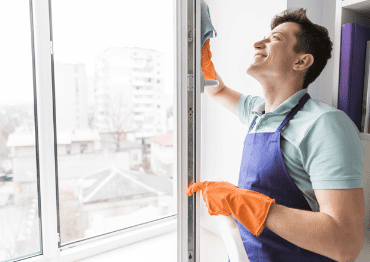 man cleaning windows 23 2148119218